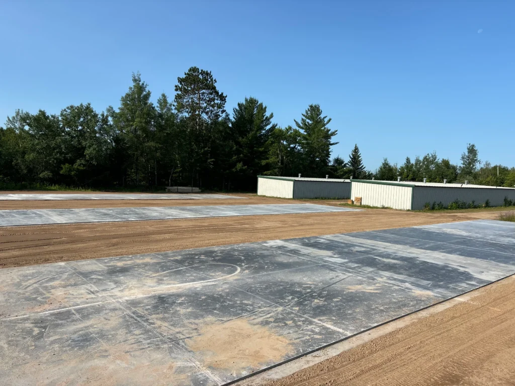 An active construction site with materials and structures in progress.