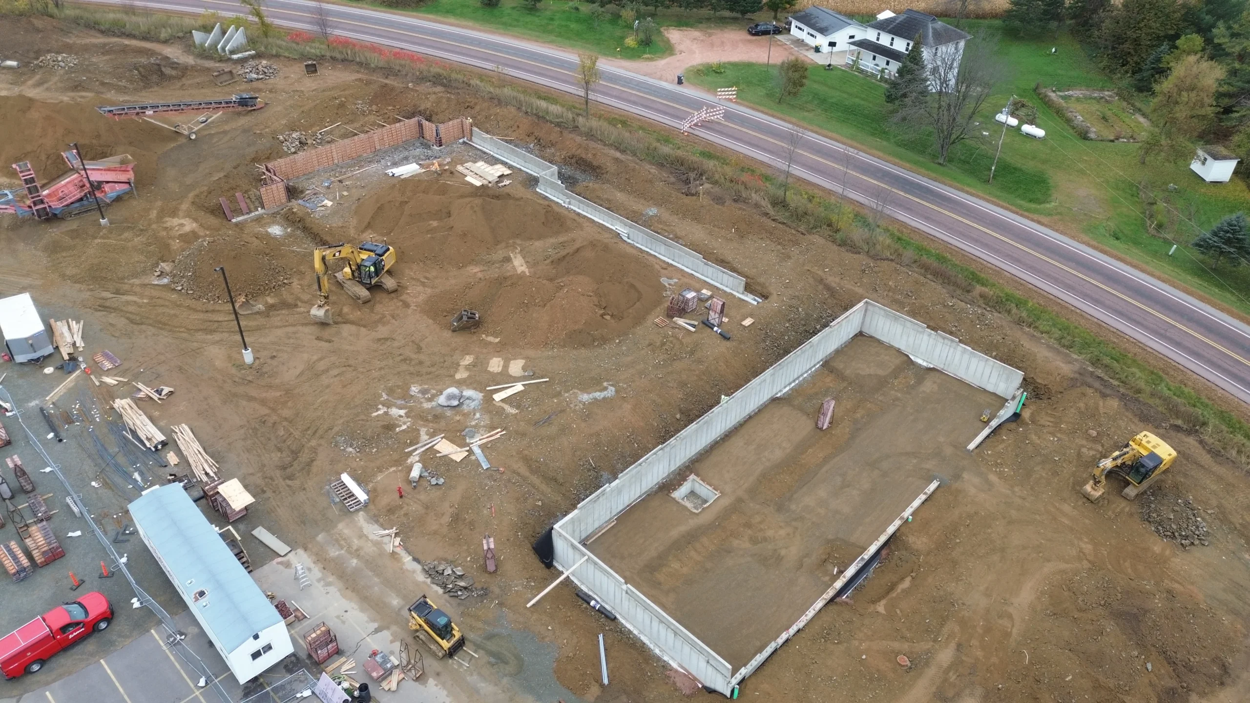 An active construction site with materials and structures in progress.