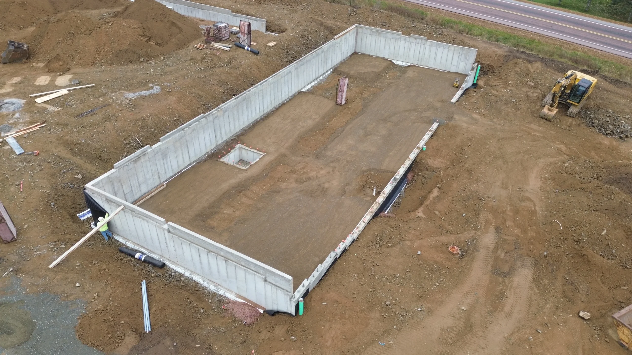 An active construction site with materials and structures in progress.