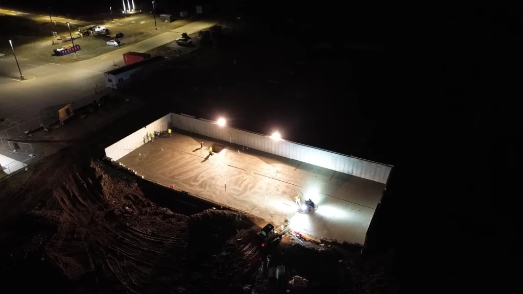 An active construction site with materials and structures in progress.