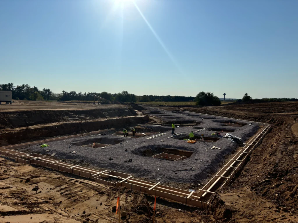 An active construction site with materials and structures in progress.