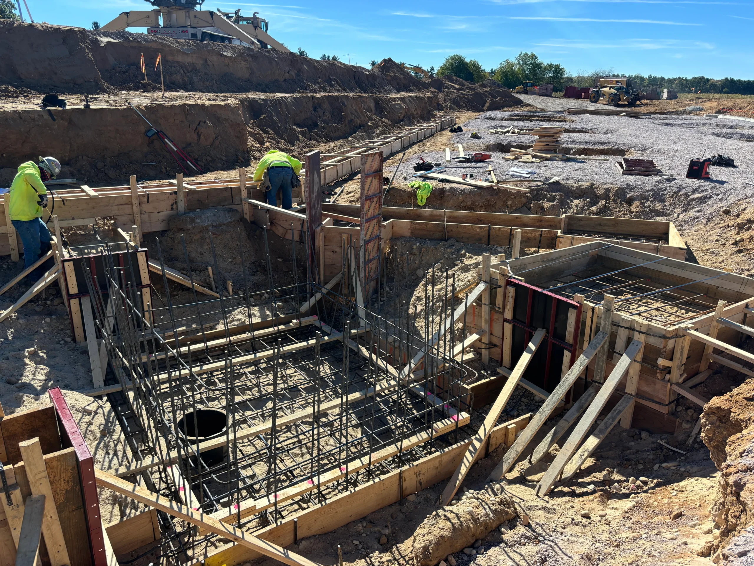 An active construction site with materials and structures in progress.
