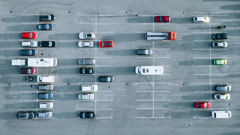 Aerial view of cars at concrete parking