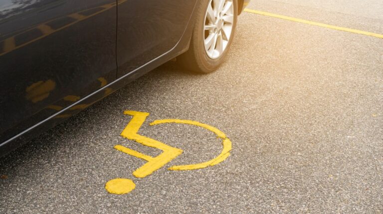 car parking on handicap parking sign symbol