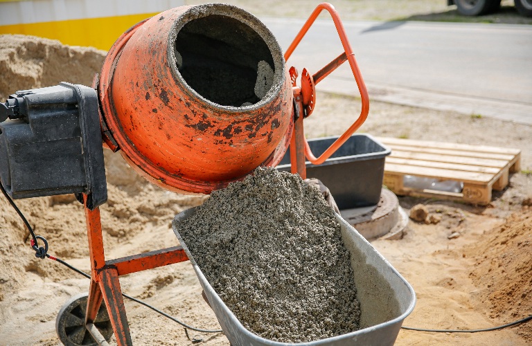 Concrete in an orange mixer on construction site