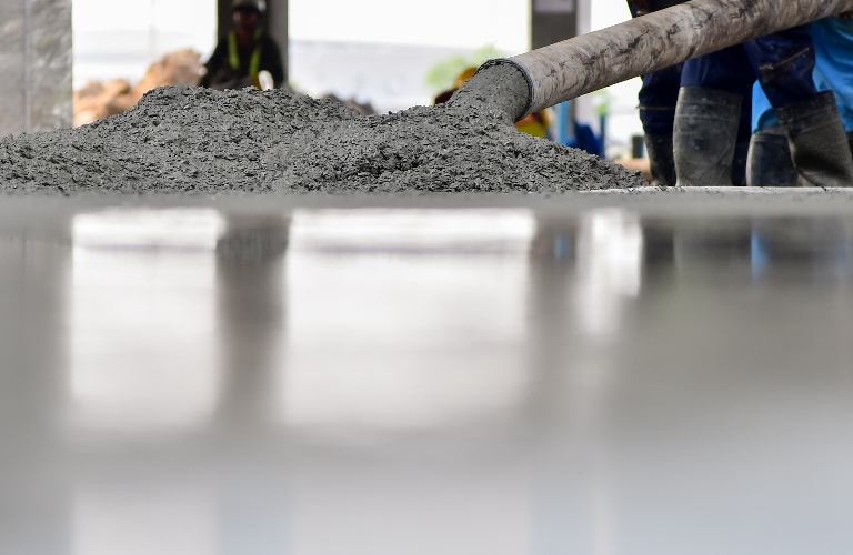Pouring concrete during commercial concreting of building floors